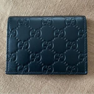 Authentic Gucci GG wallet. Black leather. Comes with box & dust bag.